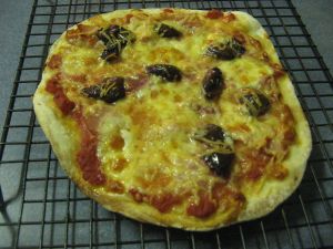 Pizza with ham and olives
